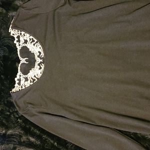 Tunic with scorpion embroidery on back of top.